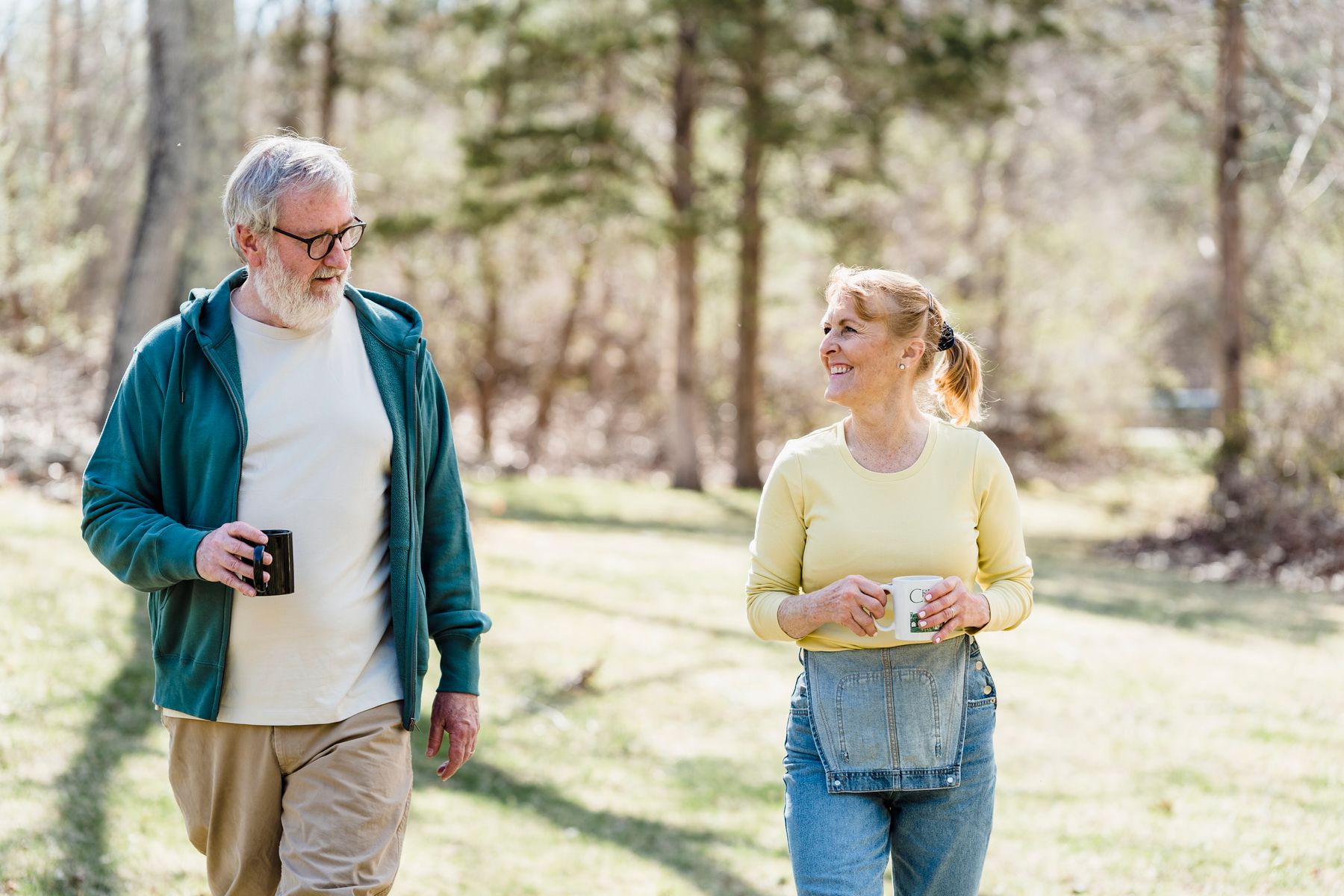 A retired couple enjoying a relaxed walk outdoors